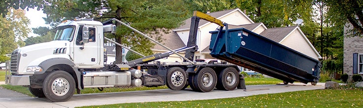 residential dumpster delivery in driveway