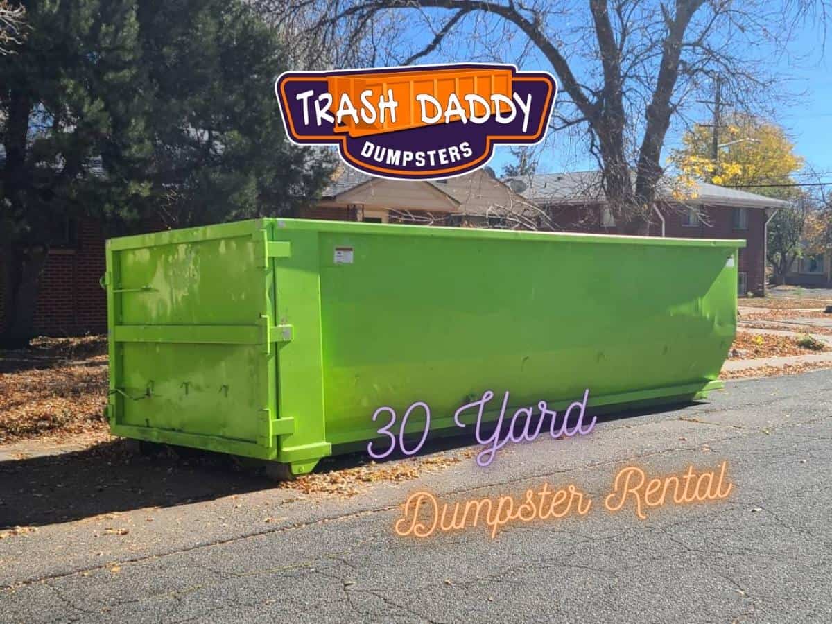 green 30 yard dumpster in the street