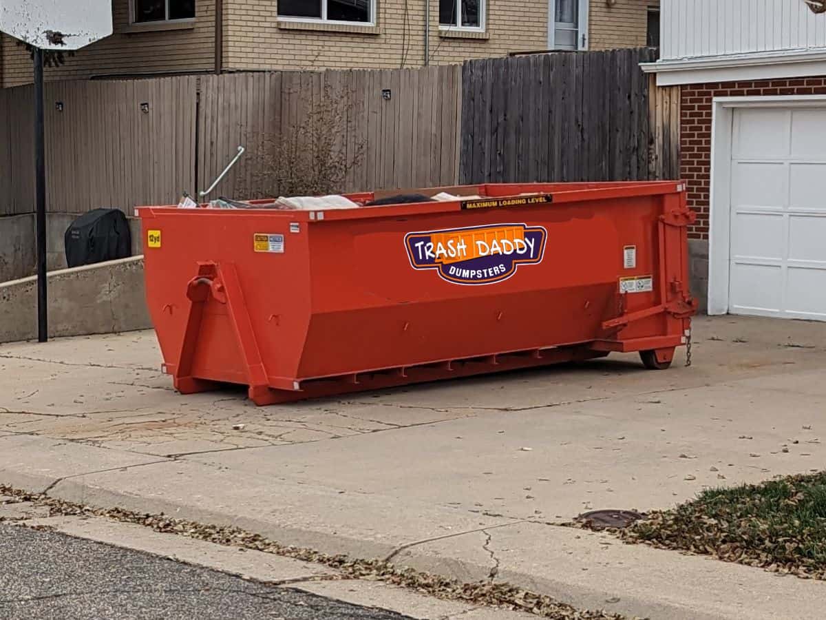 orange 12 yard roll off dumpster