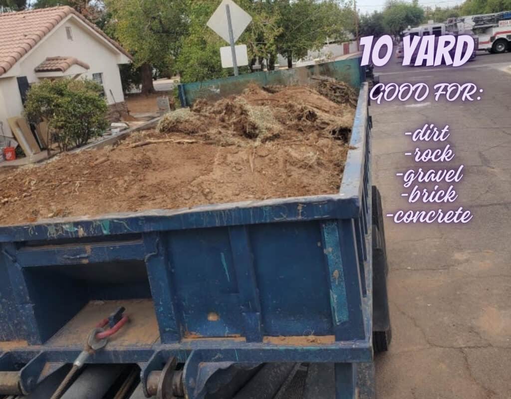 10 yard lowboy dumpster with dirt