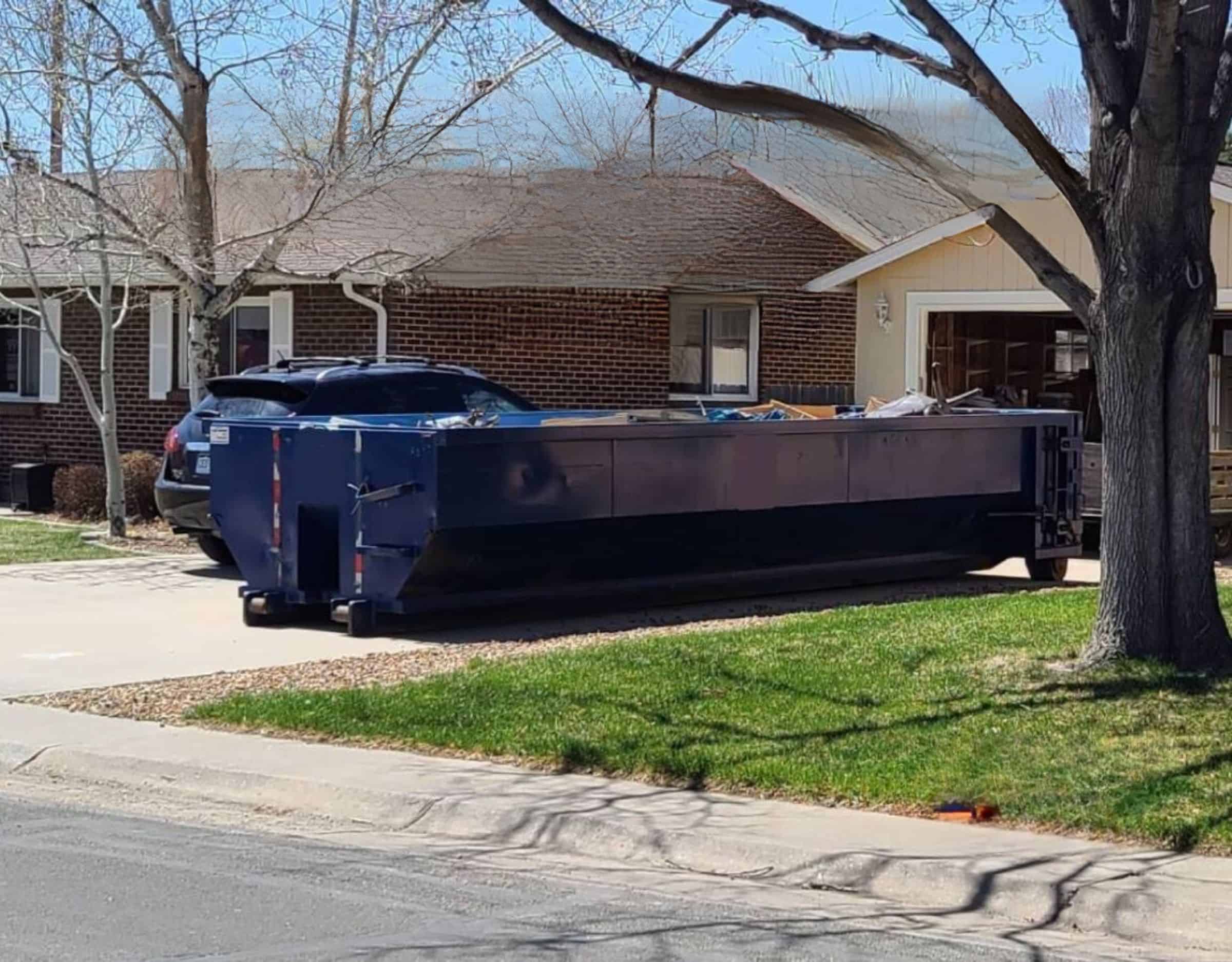 residential 20 yard dumpster rental in driveway