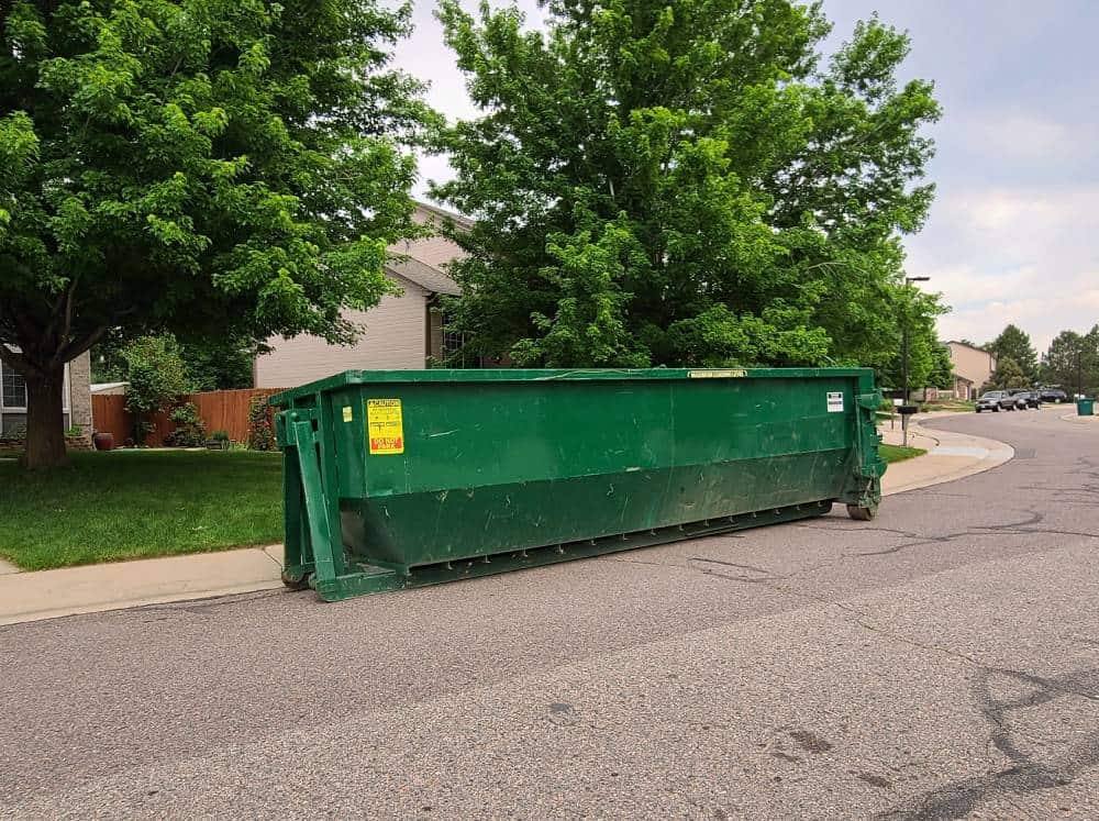 green 30 yard dumpster rental on the street