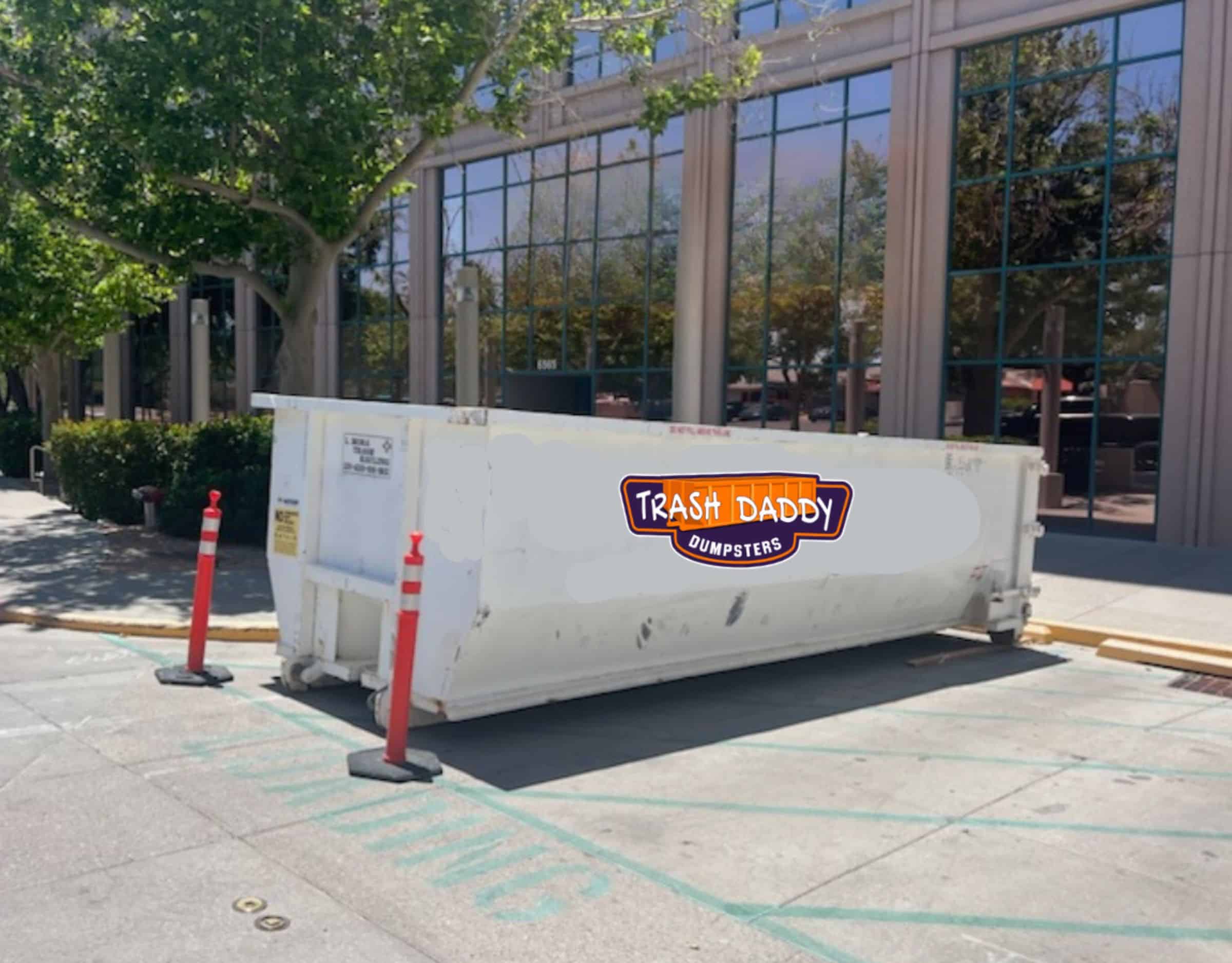 white dumpster rental in parking lot