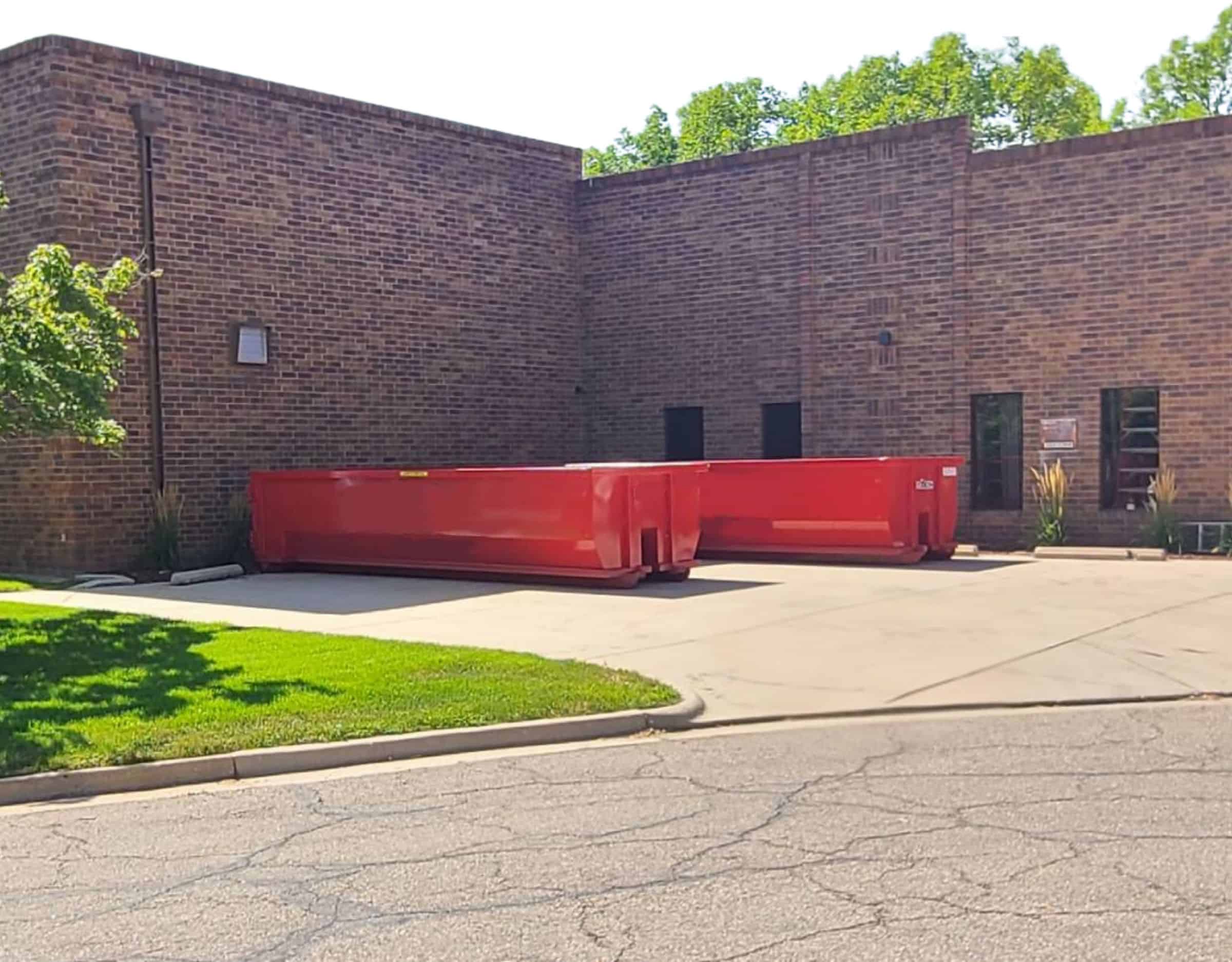 2 red 20 yard dumpsters