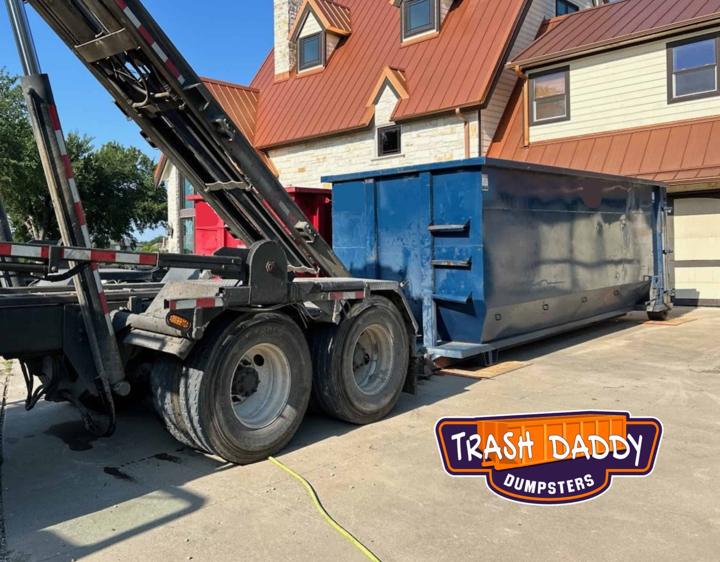 blue 40 yard dumpster dropped next to a red 40 yard dumpster