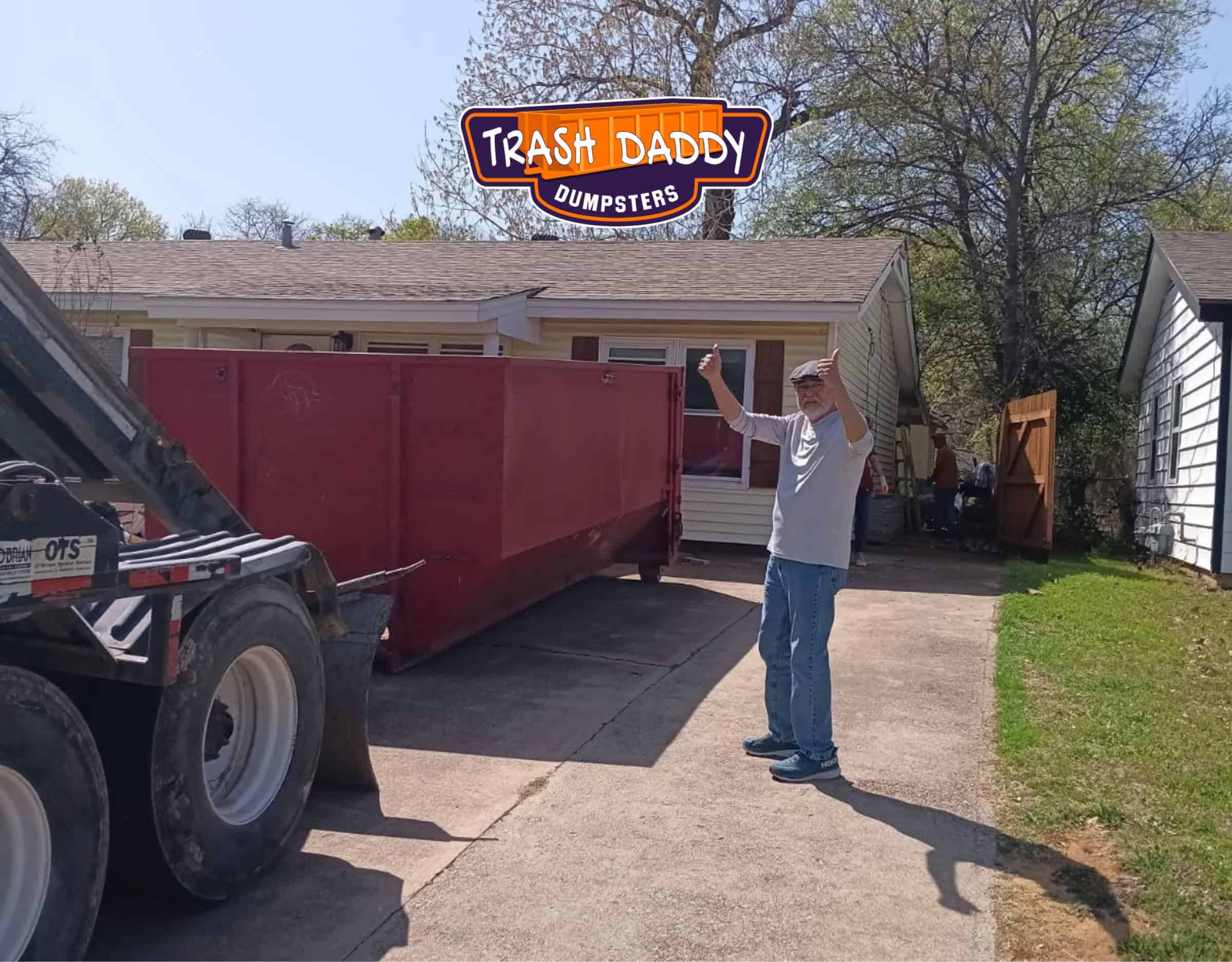 red 15 yard dumpster in customer's driveway