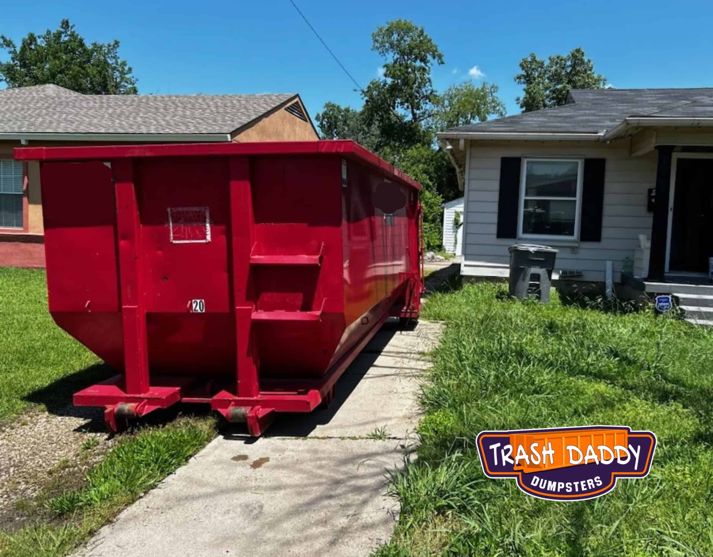 red high side 20 yard in a residential driveway