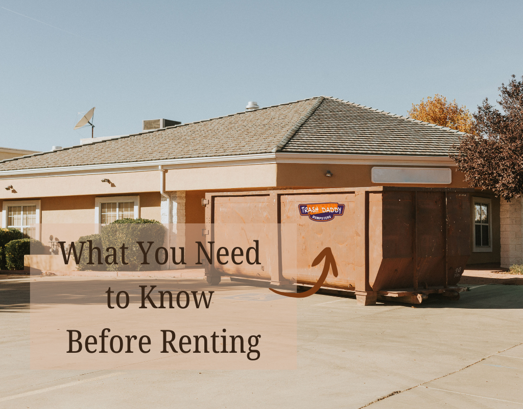 Brown roll-off dumpster in front of a commercial building