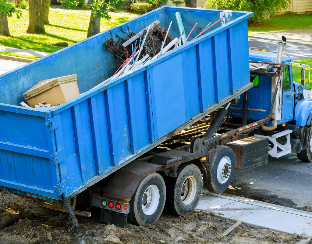 Dumpster being picked up after being placed properly for project